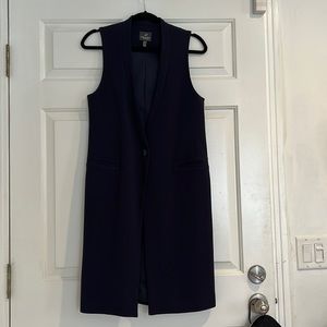 One button fitted vest/dress. Looks super cute over leggings and a t-shirt.